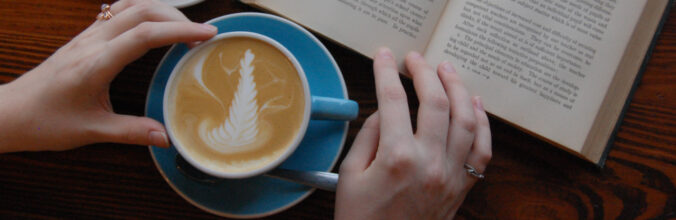 picture of a cup of coffee and a book